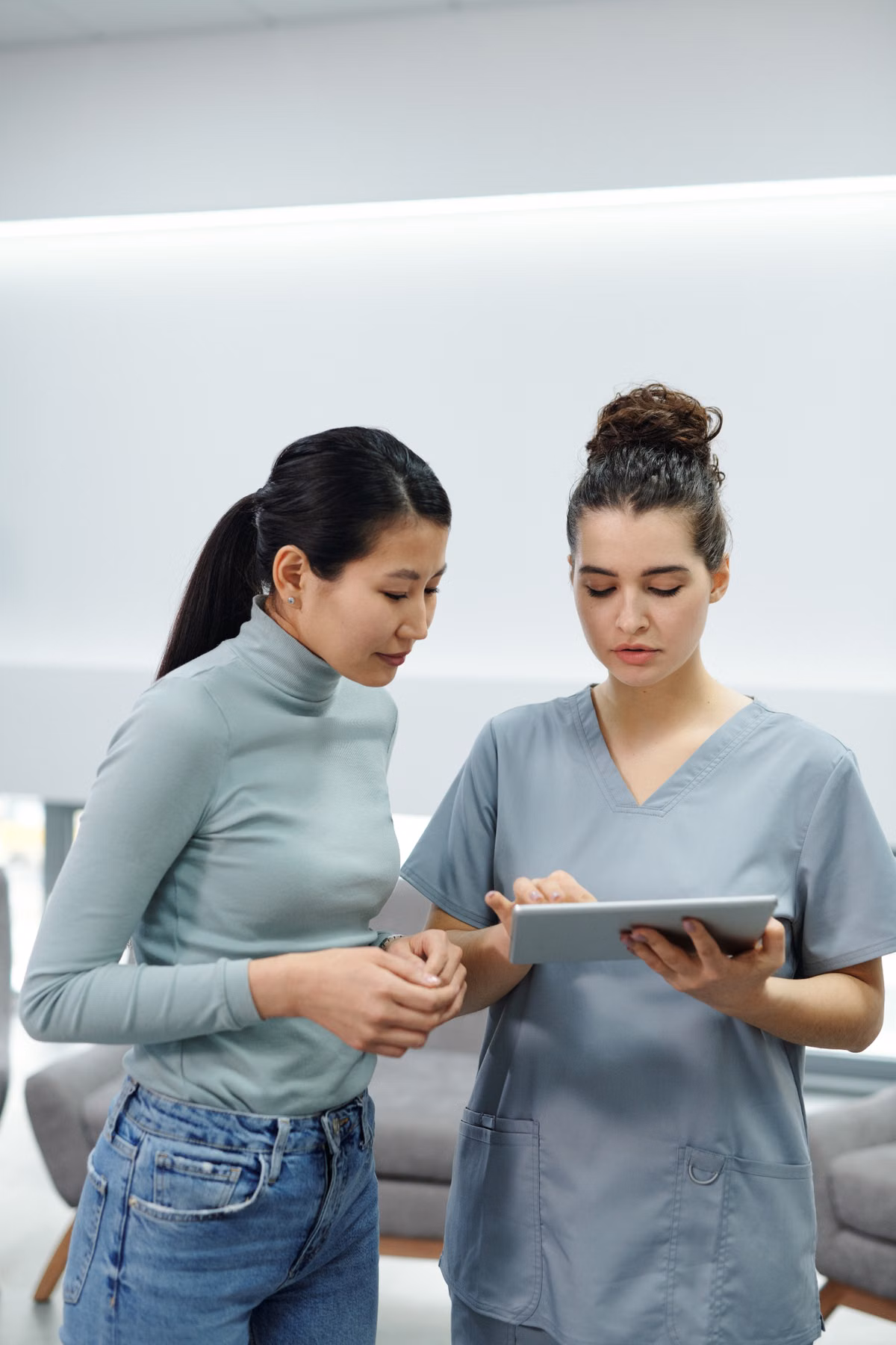 Care coordinator reviewing a patient's digital program on a tablet