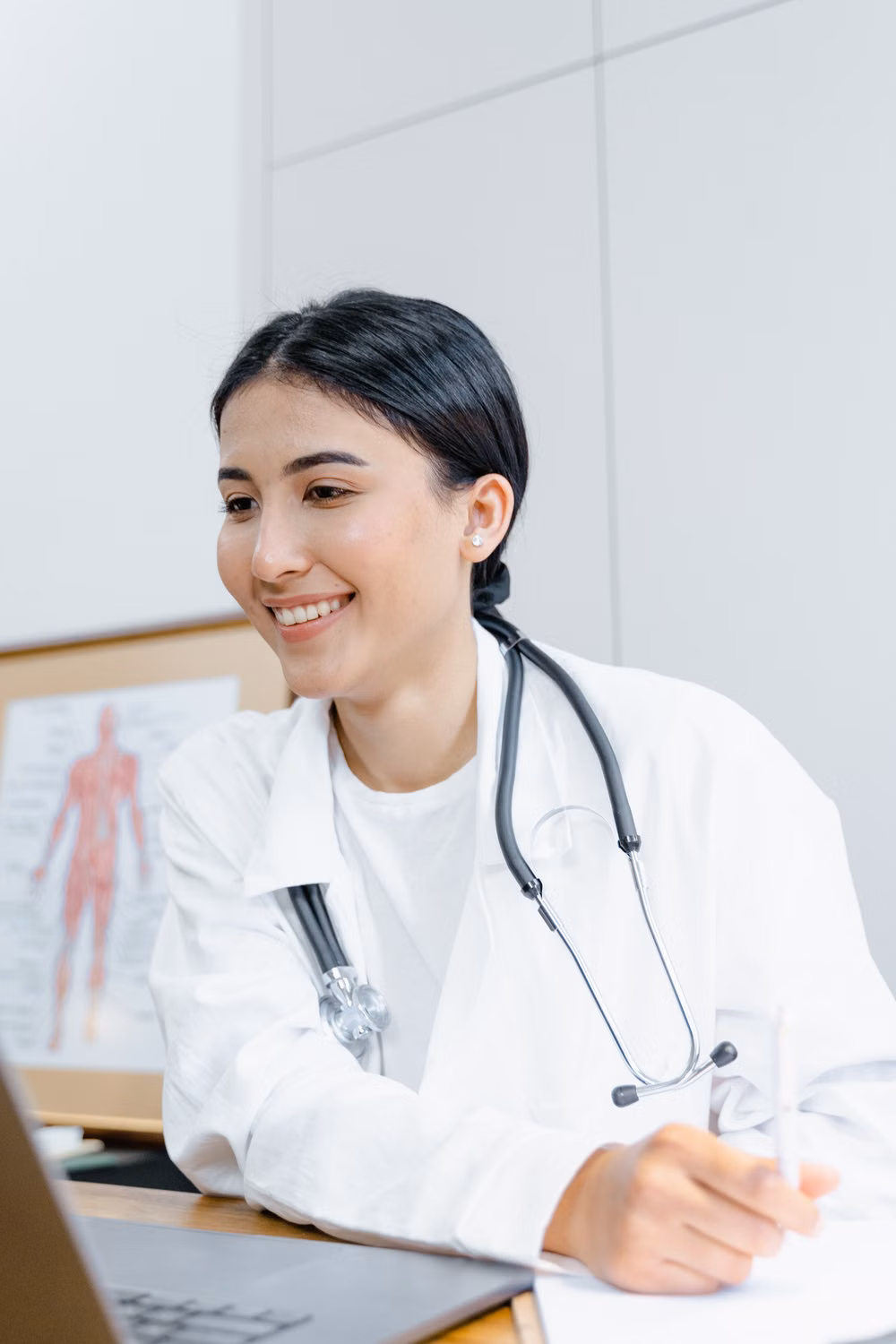 Doctor conducting an online consultation using a laptop